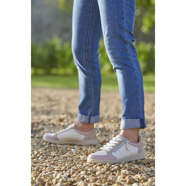 Josef Seibel Jade 05 Ladies Rosa Multi leather lace-up trainers, with zippers, on a gravel path with blue jeans.
