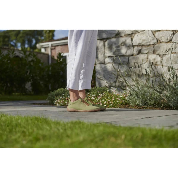 Josef Seibel Wynona 06 ladies green leather lace-up shoes on a woman's feet outdoors.