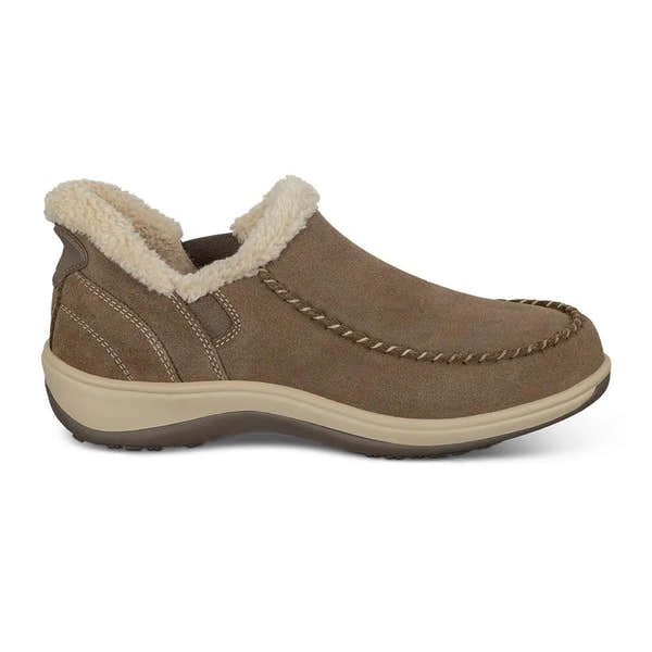 Brown suede slip-on house shoe with faux shearling lining, cushioned sole, and moccasin-style stitching.