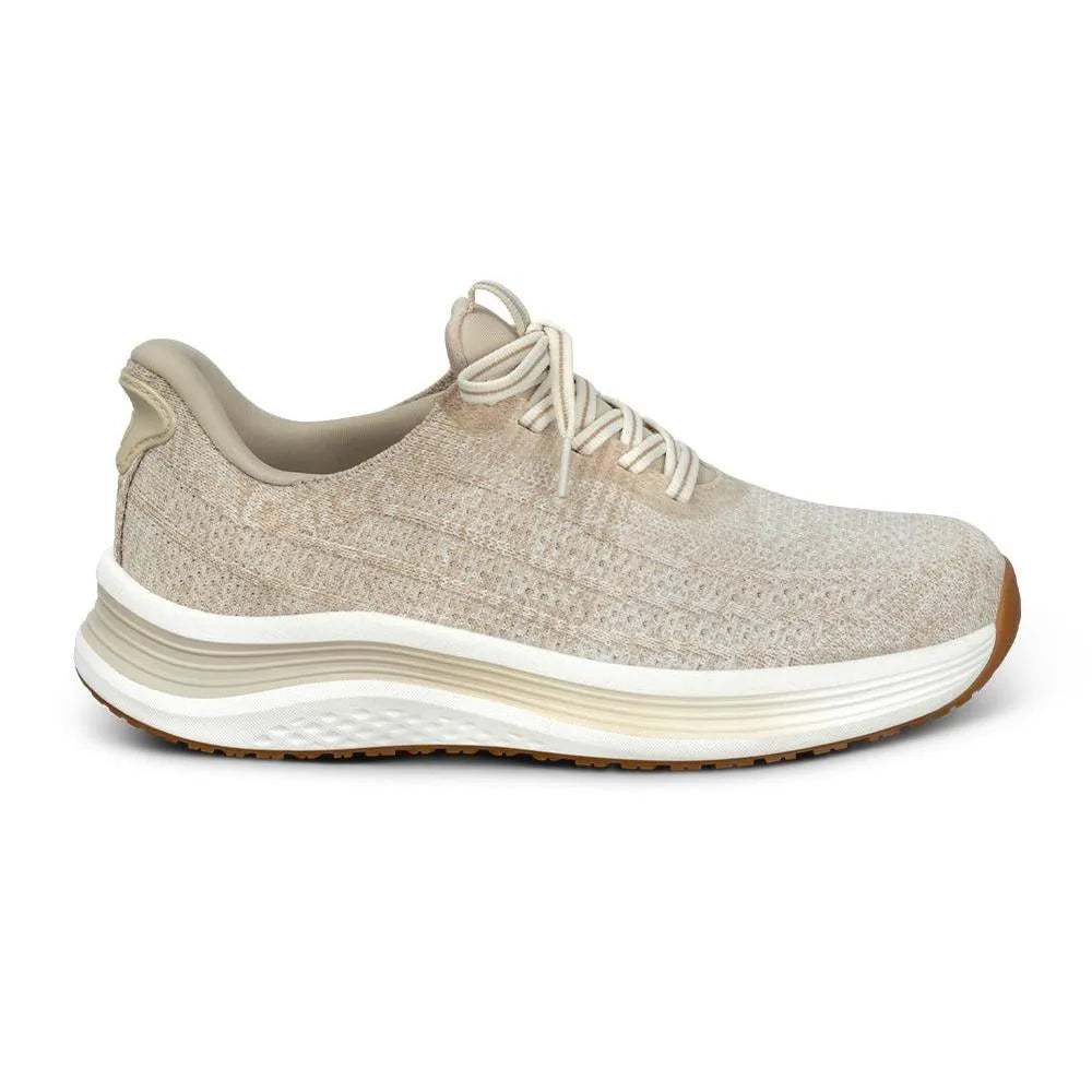 Blonde textile trainer with elasticated laces, cushioned sole, and arch support for ladies.