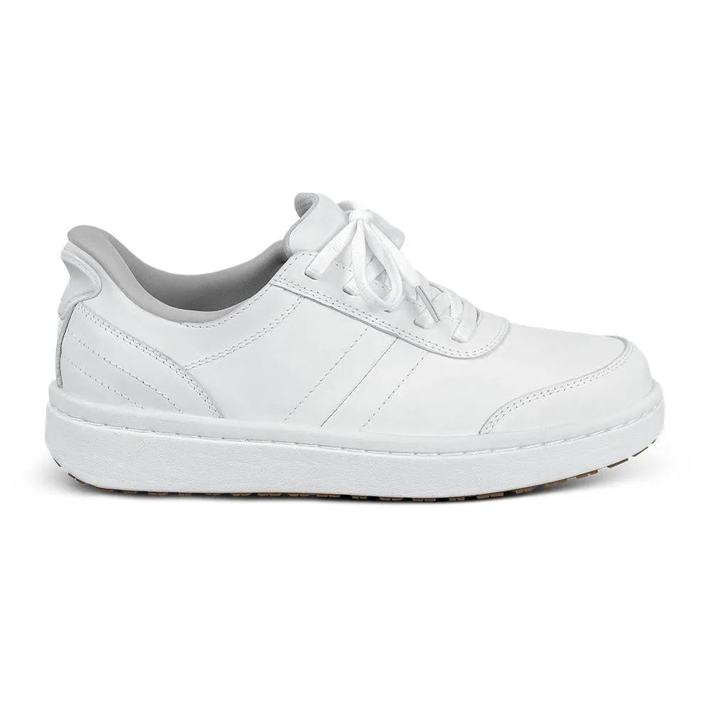 White leather lace-up trainers with arch support, cushioned interior, and textured rubber sole.