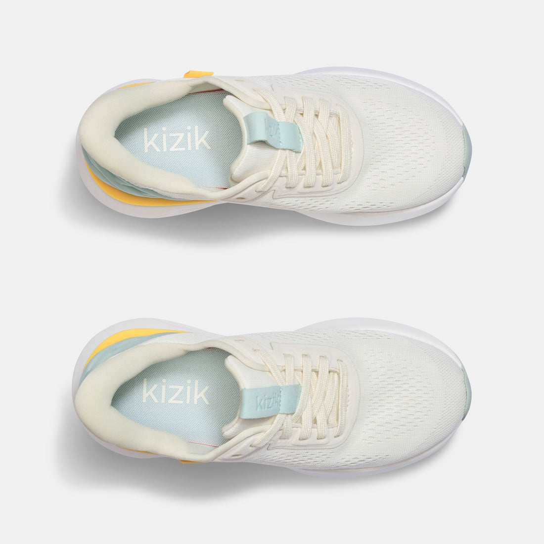 Kizik Athens 2.0 ladies slip-on trainers with textile upper, arch support, lightweight design, and neutral color.