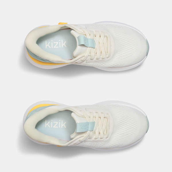 Kizik Athens 2.0 ladies slip-on trainers with textile upper, arch support, lightweight design, and neutral color.