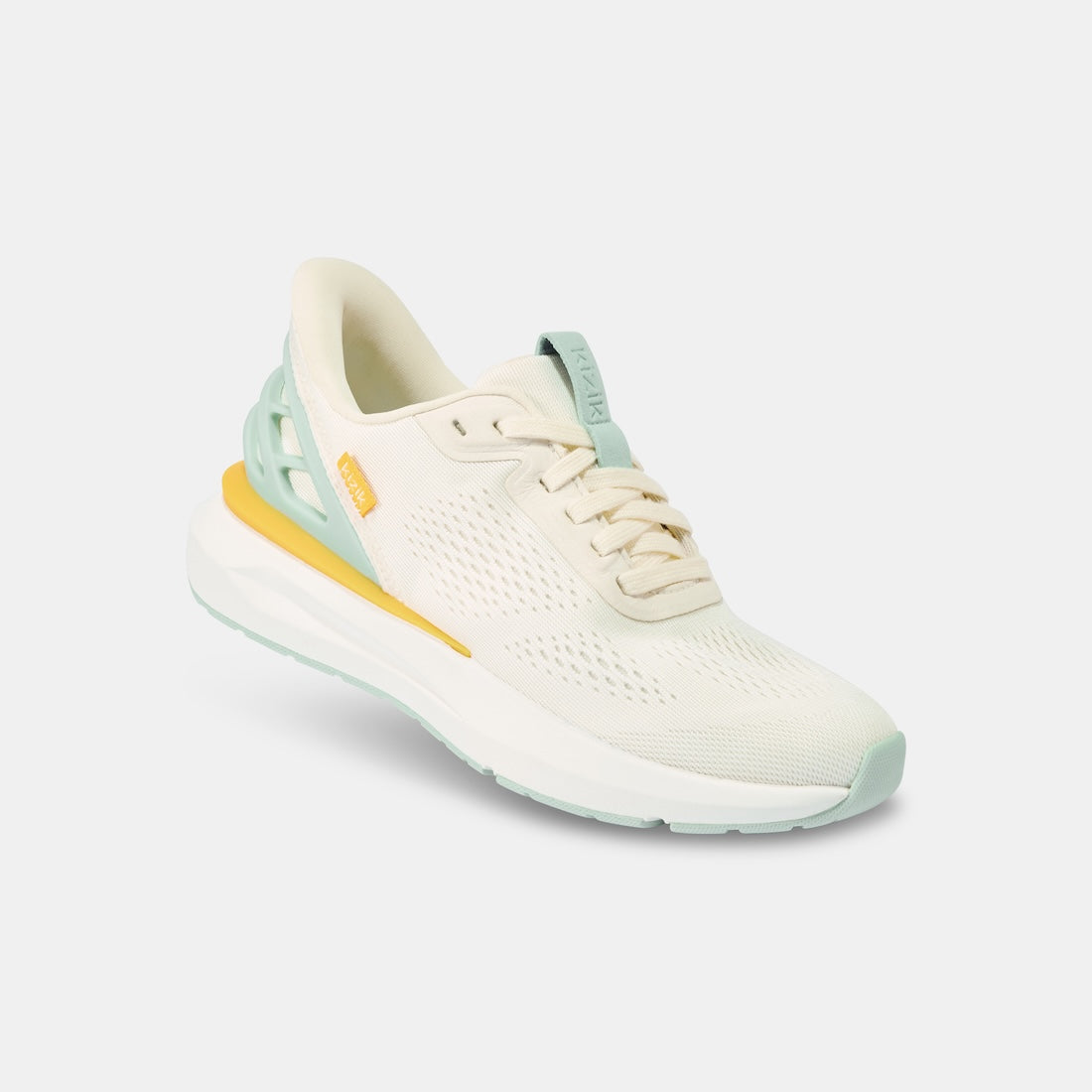 Kizik Athens 2.0 Ladies slip-on trainers with textile upper, arch support, breathable design, in pastel green, cream, and yellow accents.