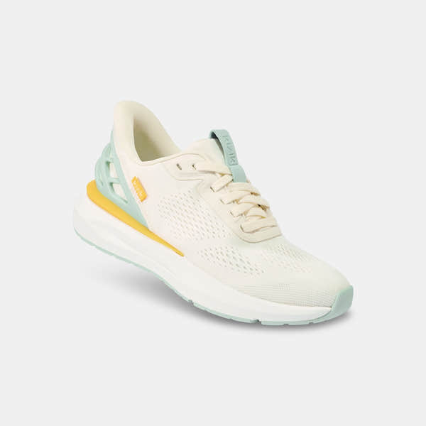 Kizik Athens 2.0 Ladies slip-on trainers with textile upper, arch support, breathable design, in pastel green, cream, and yellow accents.