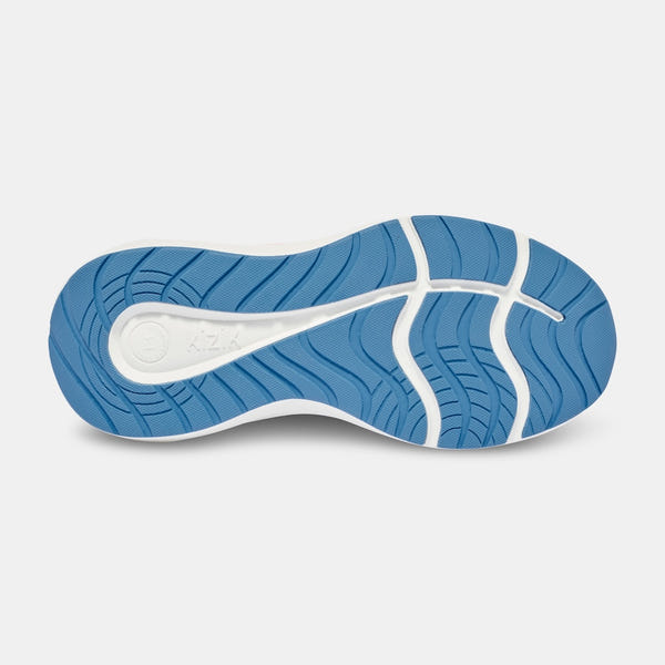 Kizik Athens 2.0 ladies slip-on trainers with peach parfait textile upper and arch support, blue and white sneaker sole, slip-on design.