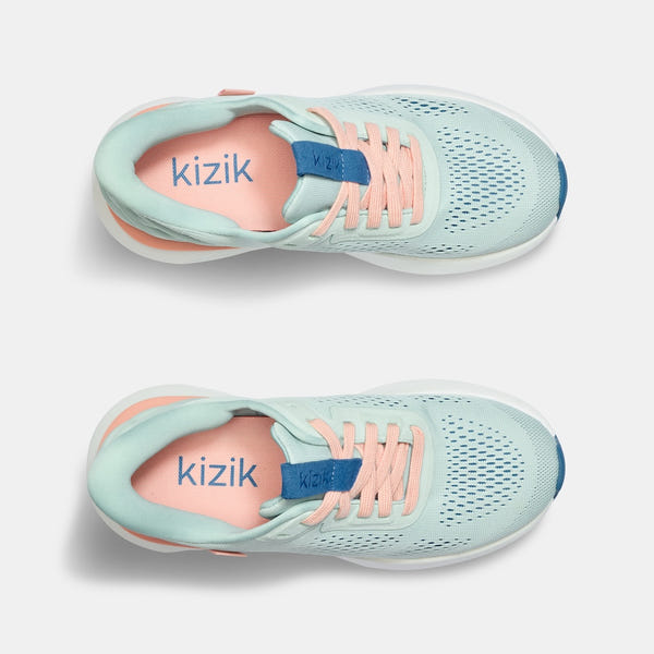 Kizik Athens 2.0 ladies slip-on trainers with peach parfait textile, arch support, breathable design, and pastel colors.