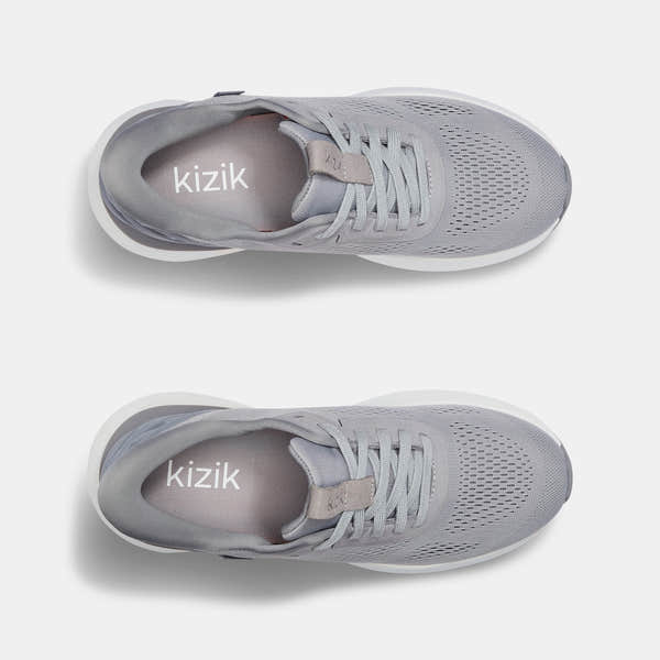 Kizik Athens 2.0 men's alloy leather slip-on trainers with arch support, breathable mesh upper, and white rubber sole.