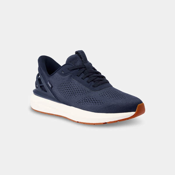Kizik Athens 2.0 men's navy leather slip-on trainers with arch support, breathable mesh upper, and cushioned white and orange rubber sole.
