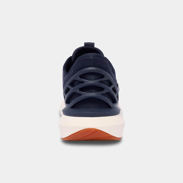 Kizik Athens 2.0 men's slip-on trainers with navy leather, arch support, and a white and orange sole.