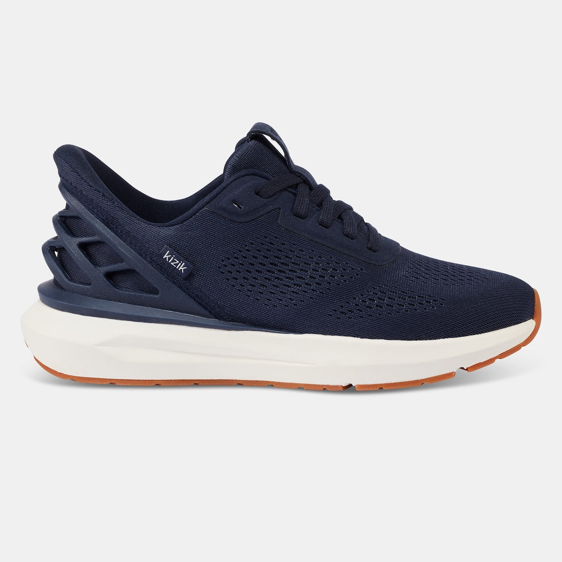 Kizik Athens 2.0 men's navy leather slip-on trainers with arch support, breathable knit upper, cushioned white midsole, and orange rubber outsole.