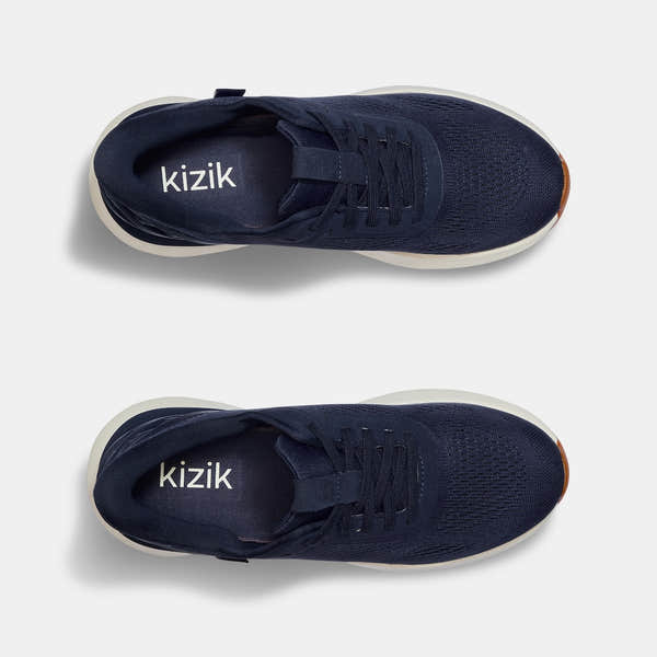 Kizik Athens 2.0 men's navy leather slip-on trainers with arch support and breathable knit upper, lightweight and comfortable casual shoes.