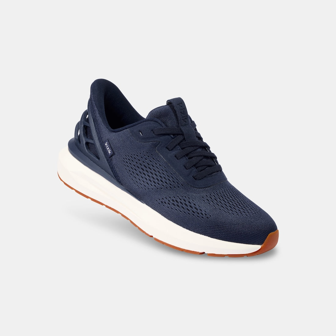 Kizik Athens 2.0 men's navy leather slip-on trainers with arch support, breathable knit upper, and cushioned white sole.