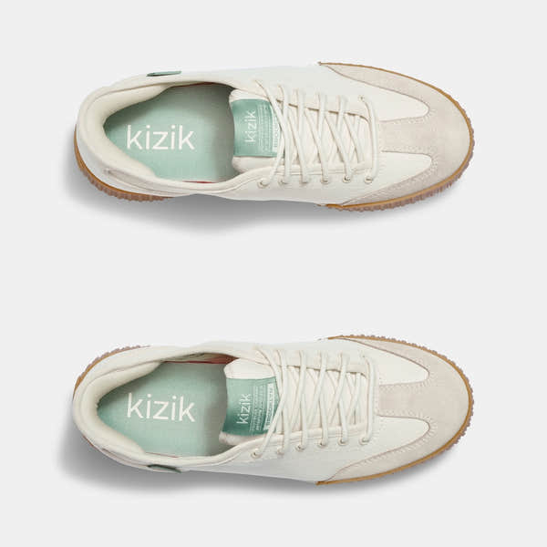 Kizik Brooklyn women's slip-on trainers with pristine leather and textile upper, arch support, and gum rubber sole.