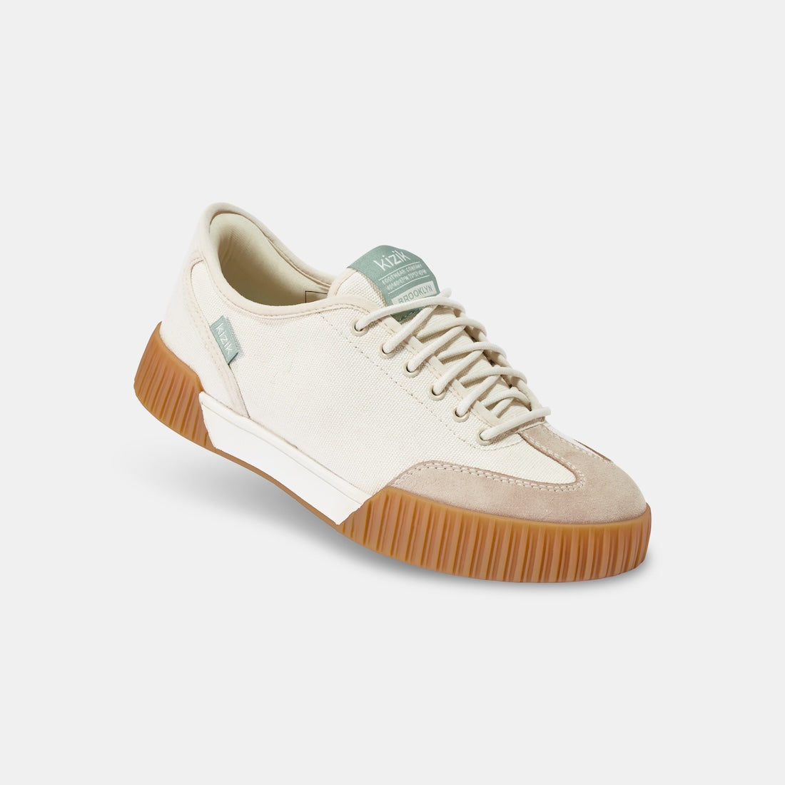 Kizik Brooklyn slip-on trainers for women, featuring pristine leather and textile upper with arch support and gum sole.