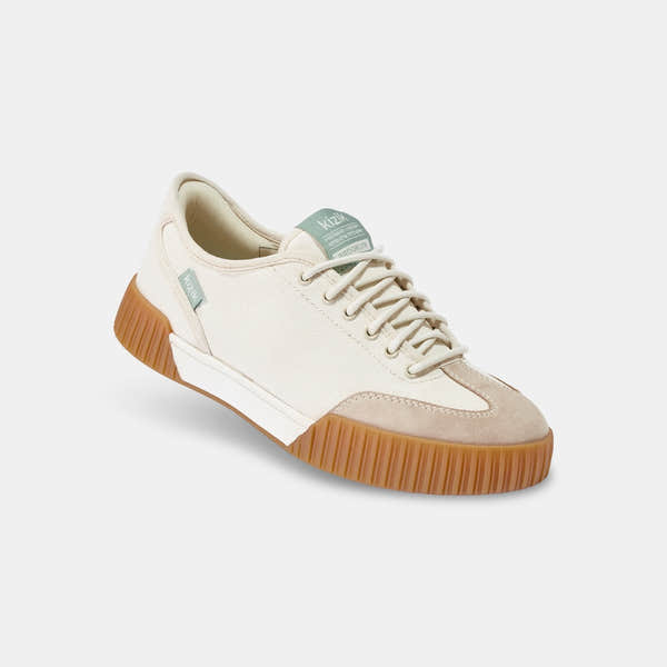 Kizik Brooklyn slip-on trainers for women, featuring pristine leather and textile upper with arch support and gum sole.