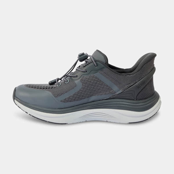 Kizik London men's Castlerock leather slip-on trainers with arch support, breathable mesh upper, and cushioned white and gray sole.