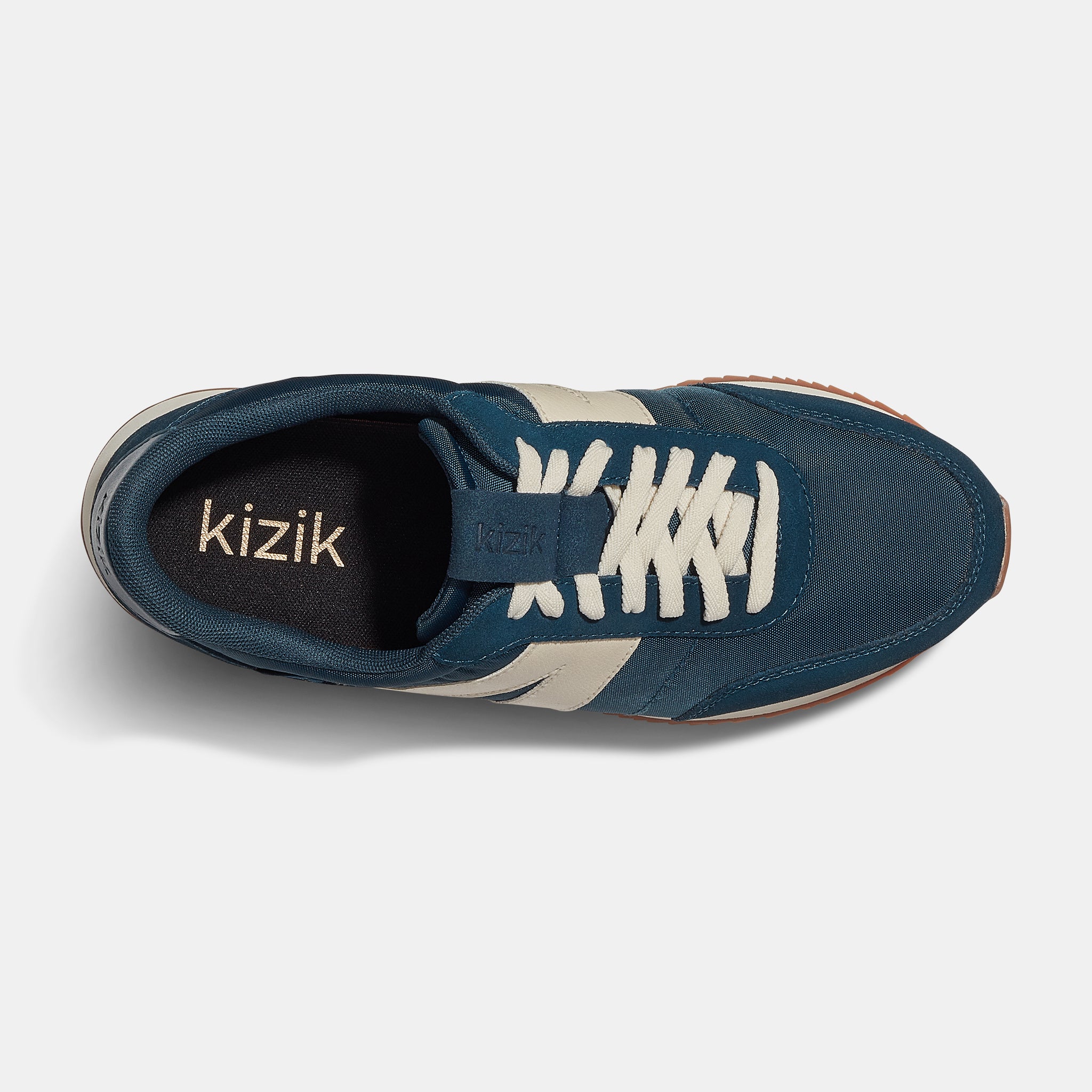 Kizik Milan unisex slip-on trainers with tidepool leather, textile upper, arch support, white laces, and rubber outsole.