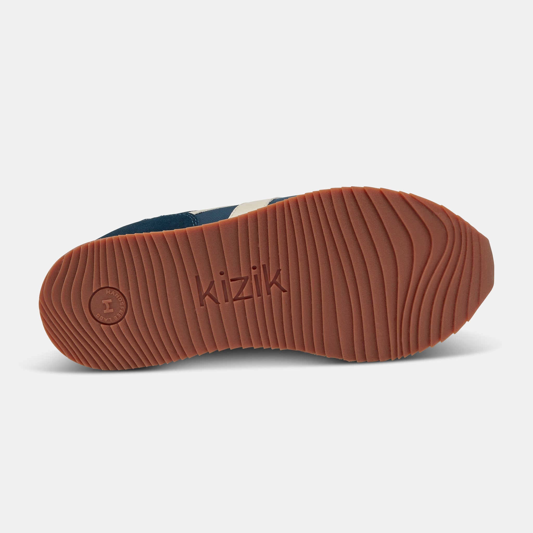 Kizik Milan unisex slip-on trainers with tidepool leather and textile upper, arch support, and rubber sole.