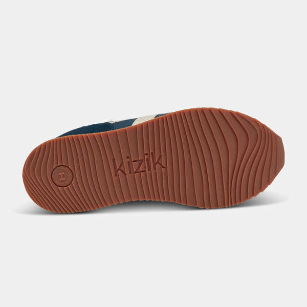 Kizik Milan unisex slip-on trainers with tidepool leather and textile upper, arch support, and rubber sole.