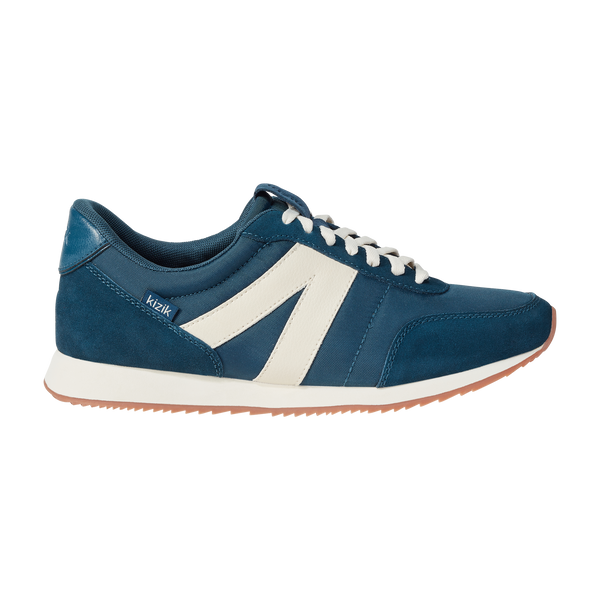 Kizik Milan unisex slip-on trainers with tidepool leather and textile upper, arch support, white side stripe, and rubber sole.