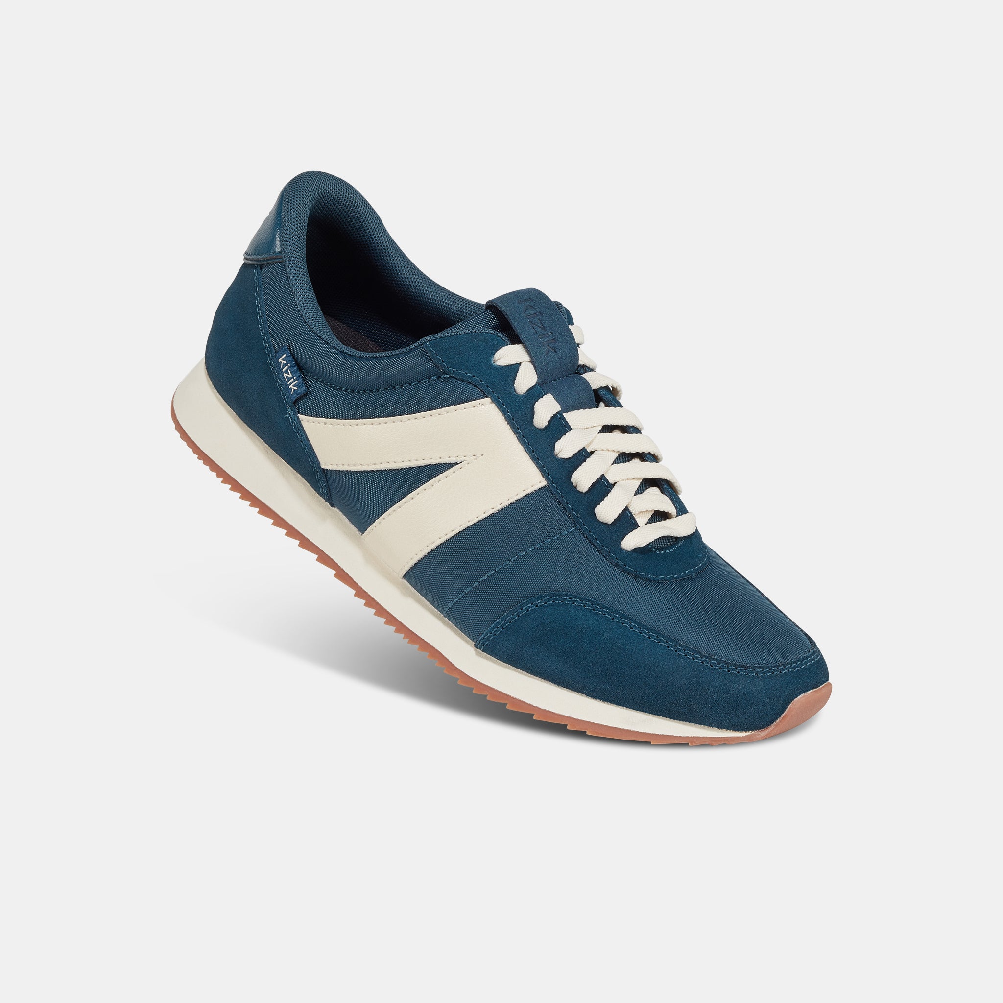 Kizik Milan unisex slip-on trainers with tidepool leather and textile upper, arch support, lace-up design, and non-slip sole.
