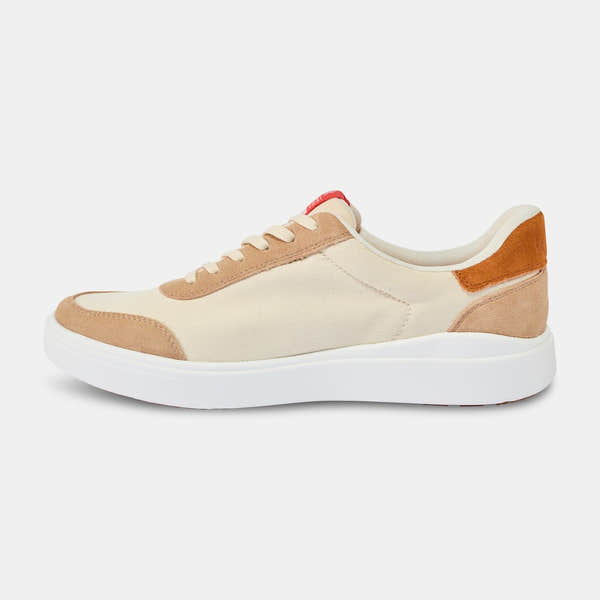 Kizik Prague 2.0 men's slip-on trainers with white and beige leather and textile upper, arch support, and white sole.