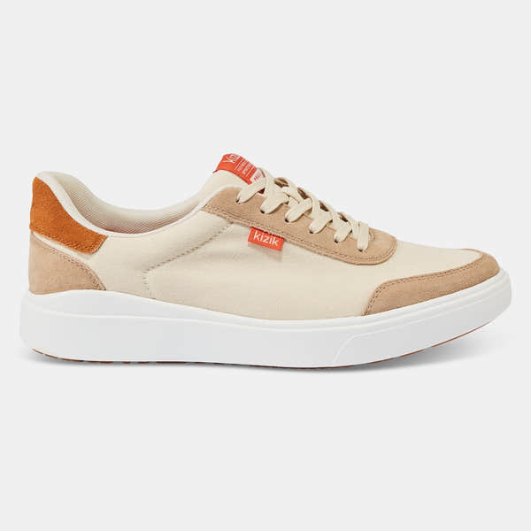 Kizik Prague 2.0 men's slip-on trainers with white, beige, and orange accents, leather and textile upper, arch support, casual style.