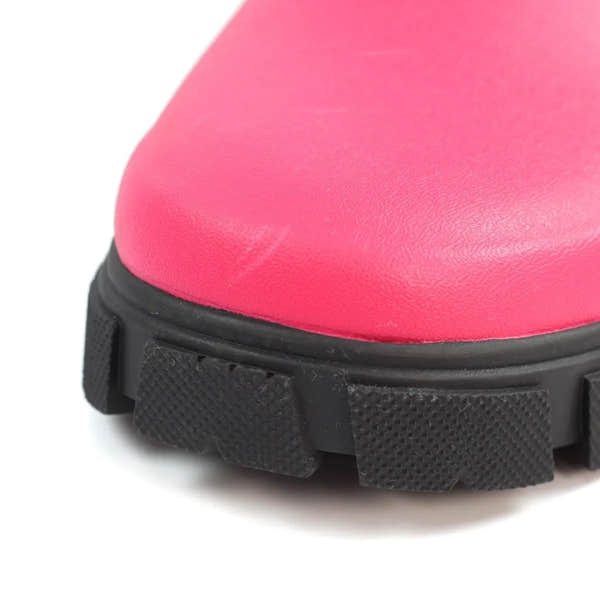 Pink waterproof wellies with elasticated sides, rugged black soles, suitable for rainy outdoor activities.