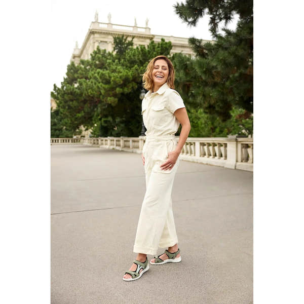 Legero Siris Pino ladies multi-leather touch fastening sandals worn by smiling woman outdoors, greenery and building in background.
