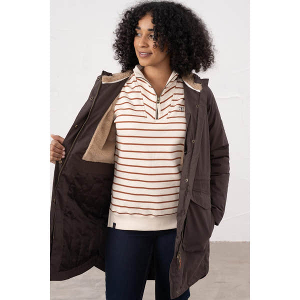 Lighthouse Isobel Cocoa women's padded waterproof coat with quilted lining, showing a woman wearing it open over a striped sweater.