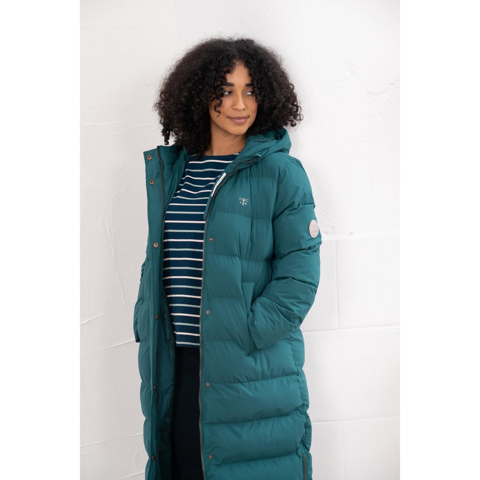 Lighthouse Savannah Pine women's puffer coat in teal, knee-length design with hood, button and zip closure, ideal for cold weather.