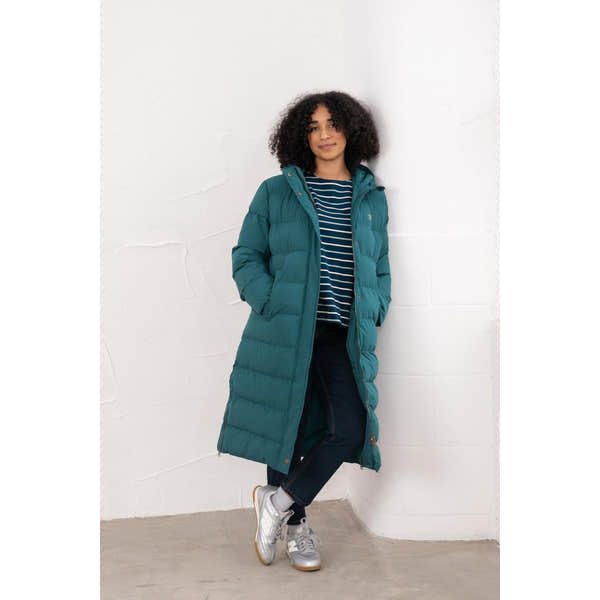 Lighthouse Savannah Pine women's puffer coat in teal with hood, worn over striped top, dark jeans, and sneakers.