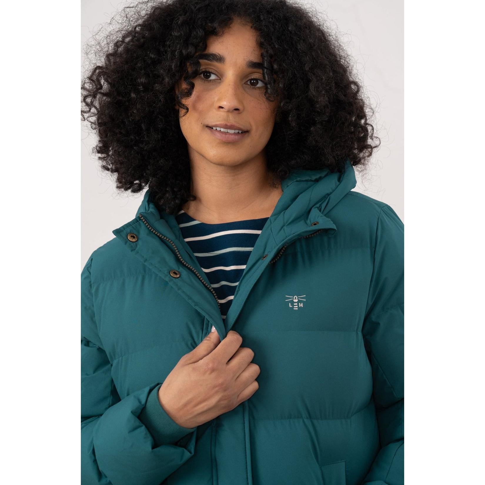 Lighthouse Savannah Pine women's puffer coat with hood, navy and striped shirt, close-up front view.