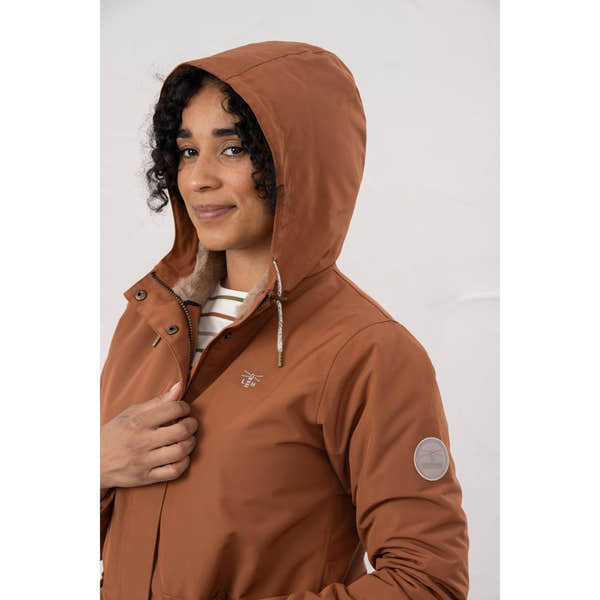 Lighthouse Scarlet Ladies Waterproof Coat in Rust color with hood, zip closure, and logo patches, ideal for rainy weather.
