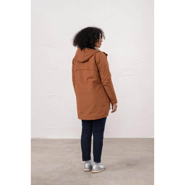 Lighthouse Scarlet Ladies Waterproof Coat in Rust color, hanging mid-length, with hood and quilted design, suitable for rainy weather.