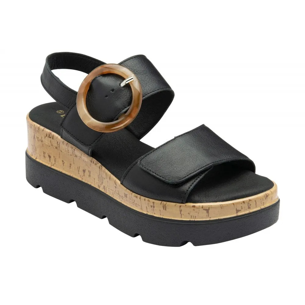 Lotus Cammie women's black leather touch fastening sandals with cork wedge and chunky sole.