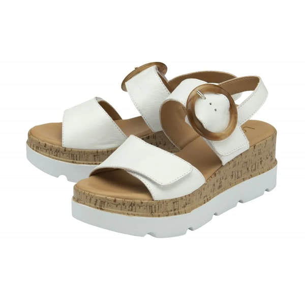 Women's white leather platform sandals with touch fastening straps and cork-detail soles.