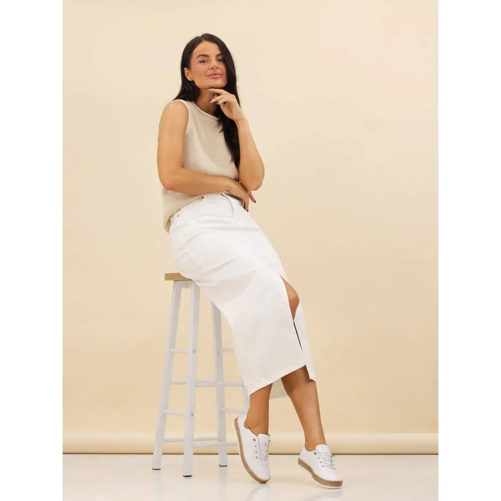 Lunar FLE050 Evie Ladies White Leather Elasticated Shoes on model with beige background, stylish and comfortable slip-ons.