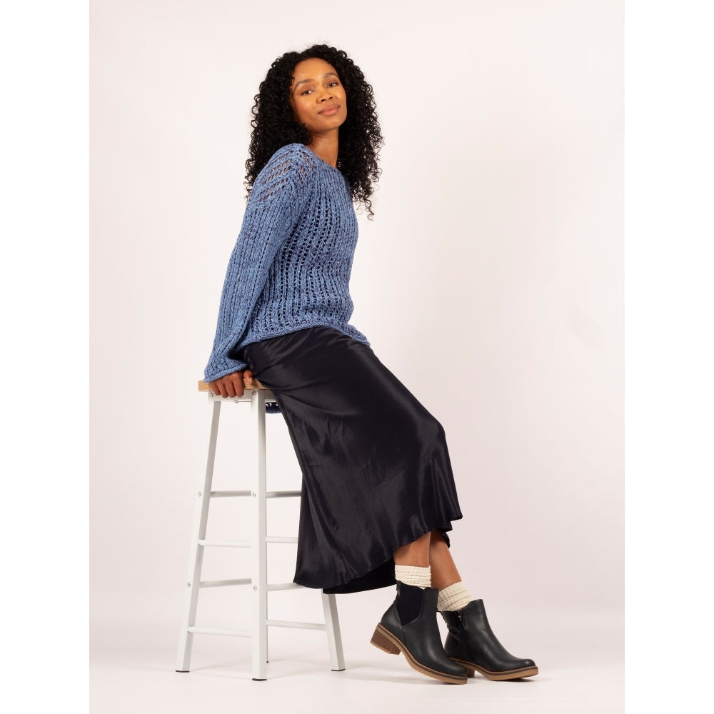 Lunar GLC013 Conrad Ladies Navy Pull-On Ankle Boots with low heel and sleek design, paired with a black satin skirt and cozy socks.