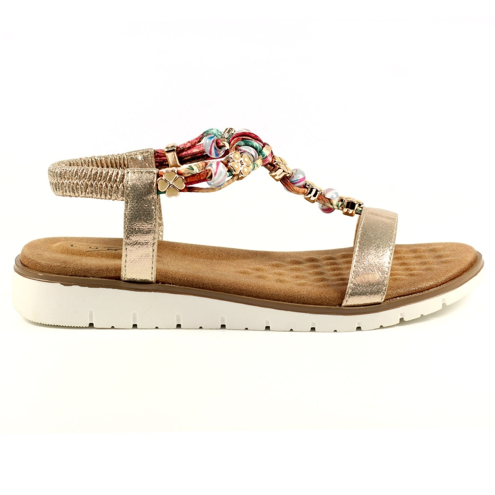Lunar JLH363 Ladies Gold Elasticated Sandals with beaded embellishments, flat sole, and adjustable ankle strap.