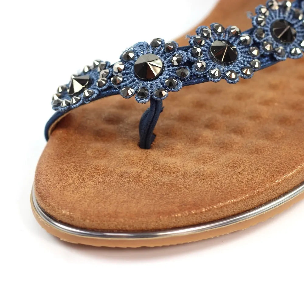 Lunar JLH455 Charlotte II Ladies Navy Sandals with elastic straps and decorative rhinestones, cushioned brown sole.