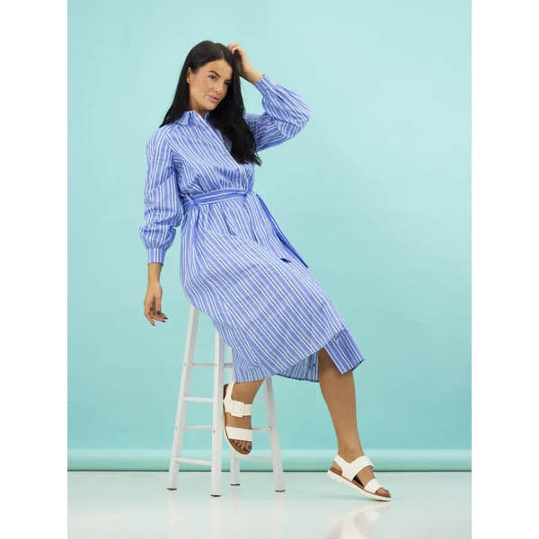 Lunar JLH517 Cher Ladies White Touch Fastening Sandals worn by woman in blue striped dress, seated on white stool.