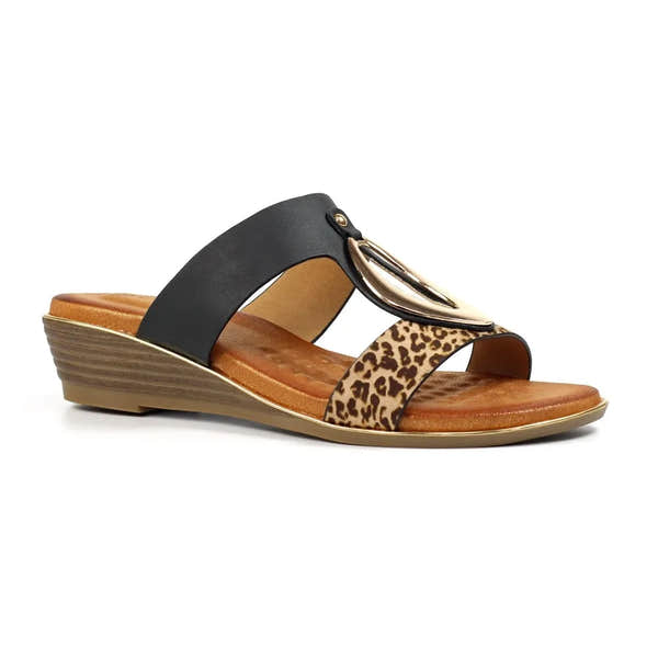 Black slip-on mule with leopard print and gold metal embellishment, cushioned insole, and wedge heel.