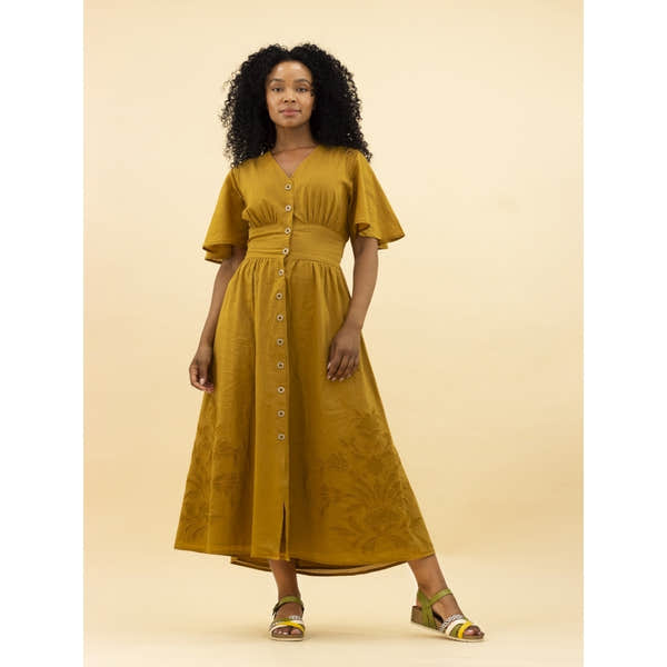 Lunar JLH527 Selina women's green buckle sandals with open toe, ankle strap, and block heel, paired with a mustard yellow maxi dress.