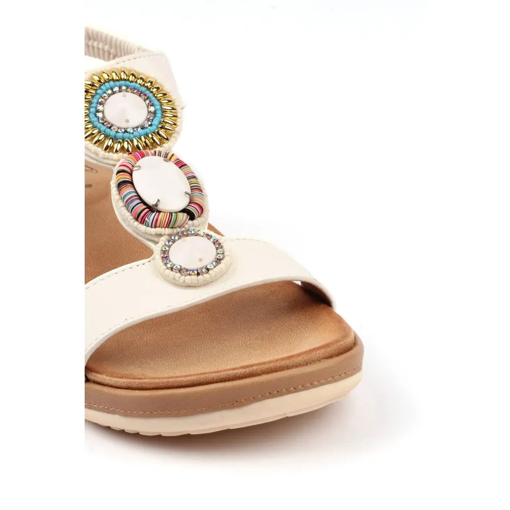 Lunar JLH589 Kay Ladies white elasticated sandals with colorful decorative circular embellishments and chunky sole.