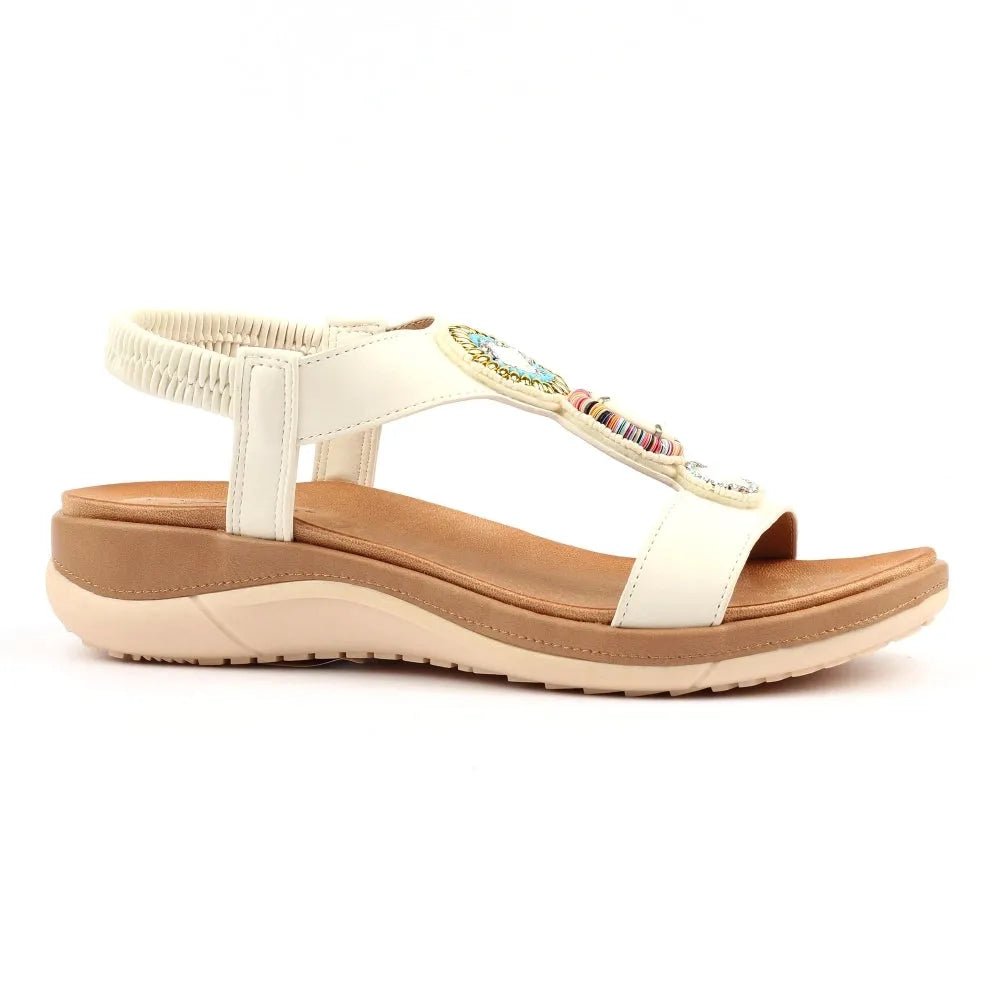 Lunar JLH589 Kay Ladies white elasticated sandal with beaded embellishment, cushioned footbed, and adjustable ankle strap.