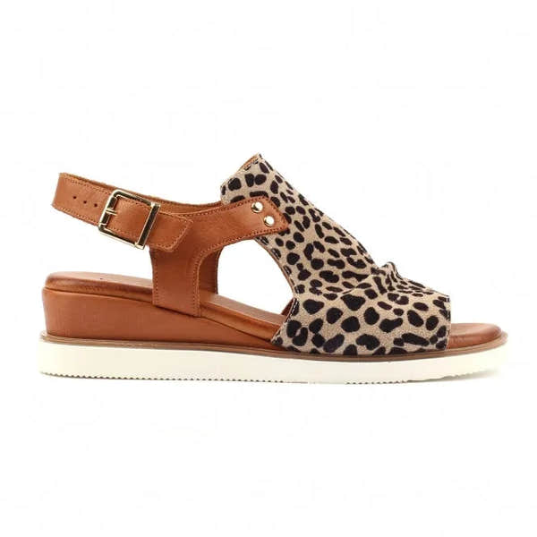 Ocelot print leather sandals with a brown buckle, open design, and a thick white sole for comfortable wear.
