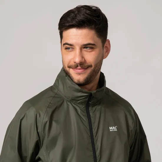 Unisex khaki Mac In A Sac Mias Origin 2 jacket with high collar, front zipper, and logo, worn by a smiling male model.