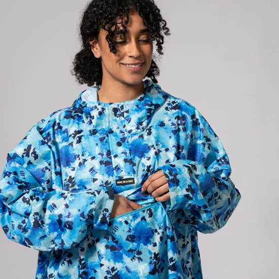 Unisex blue Daze festival poncho with camouflage pattern, waterproof, lightweight, and stylish for outdoor events.